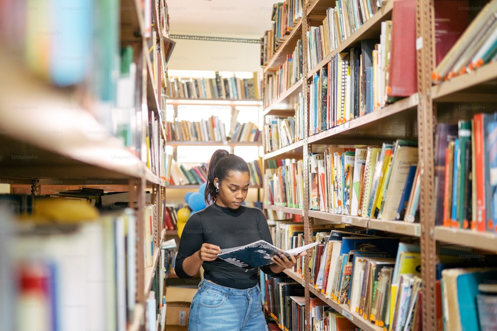 a woman reading a book in a library