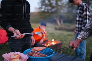 a man is grilling food on a grill