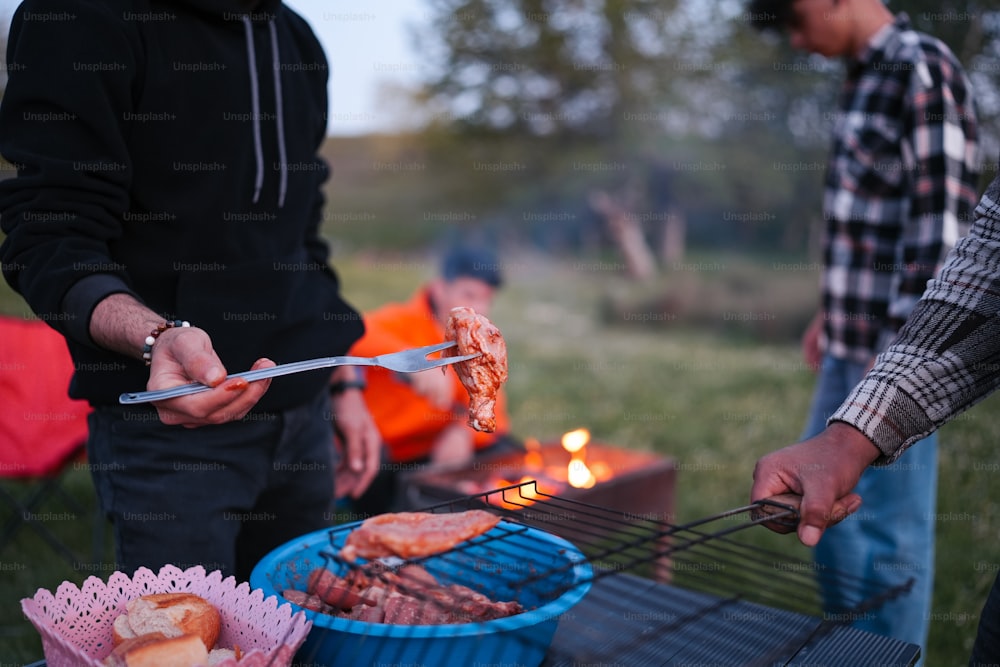 a man is grilling food on a grill