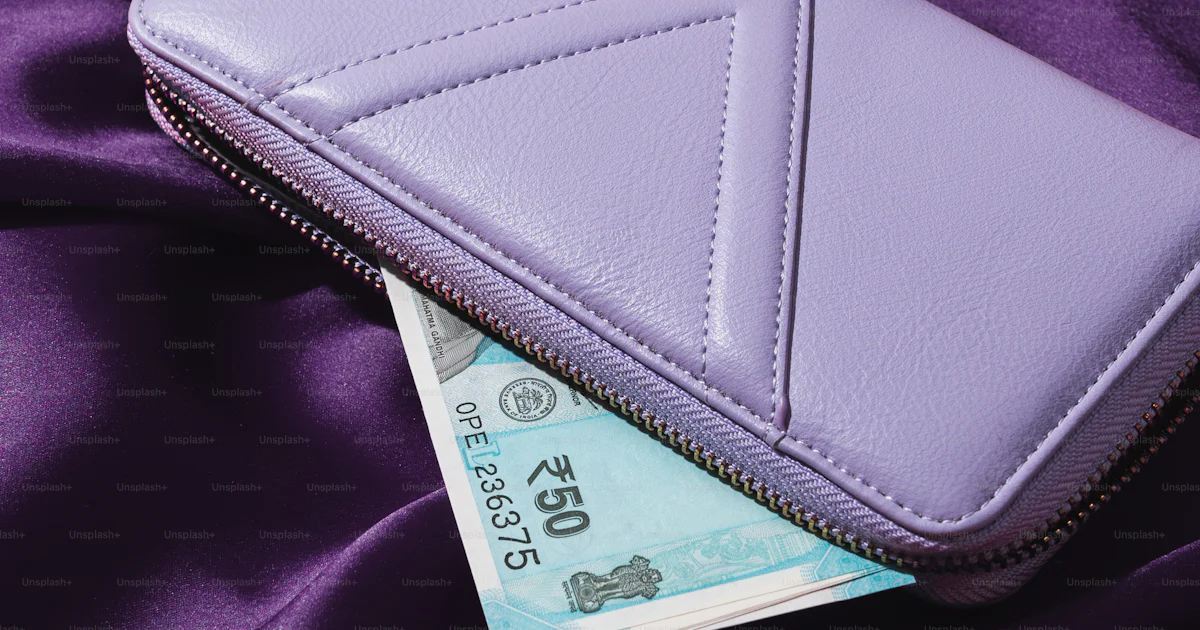 A purple wallet sitting on top of a purple cloth photo – Wallpaper ...