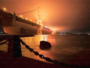 a foggy view of the golden gate bridge at night