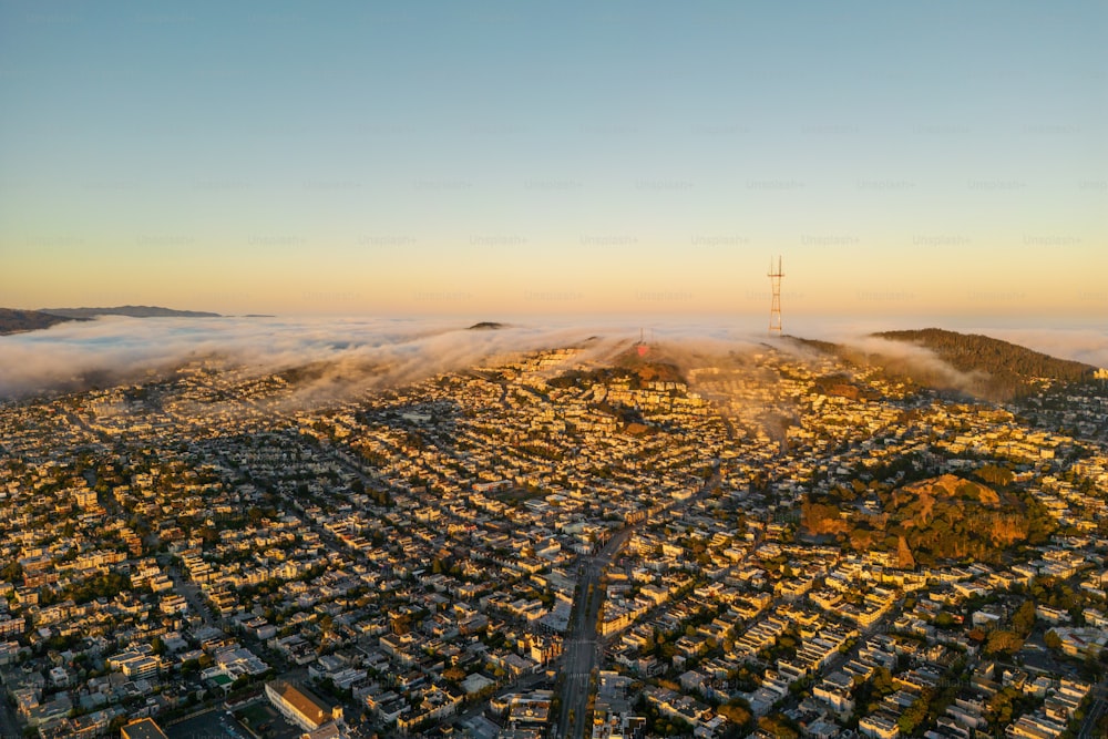 an aerial view of a city with a mountain in the background