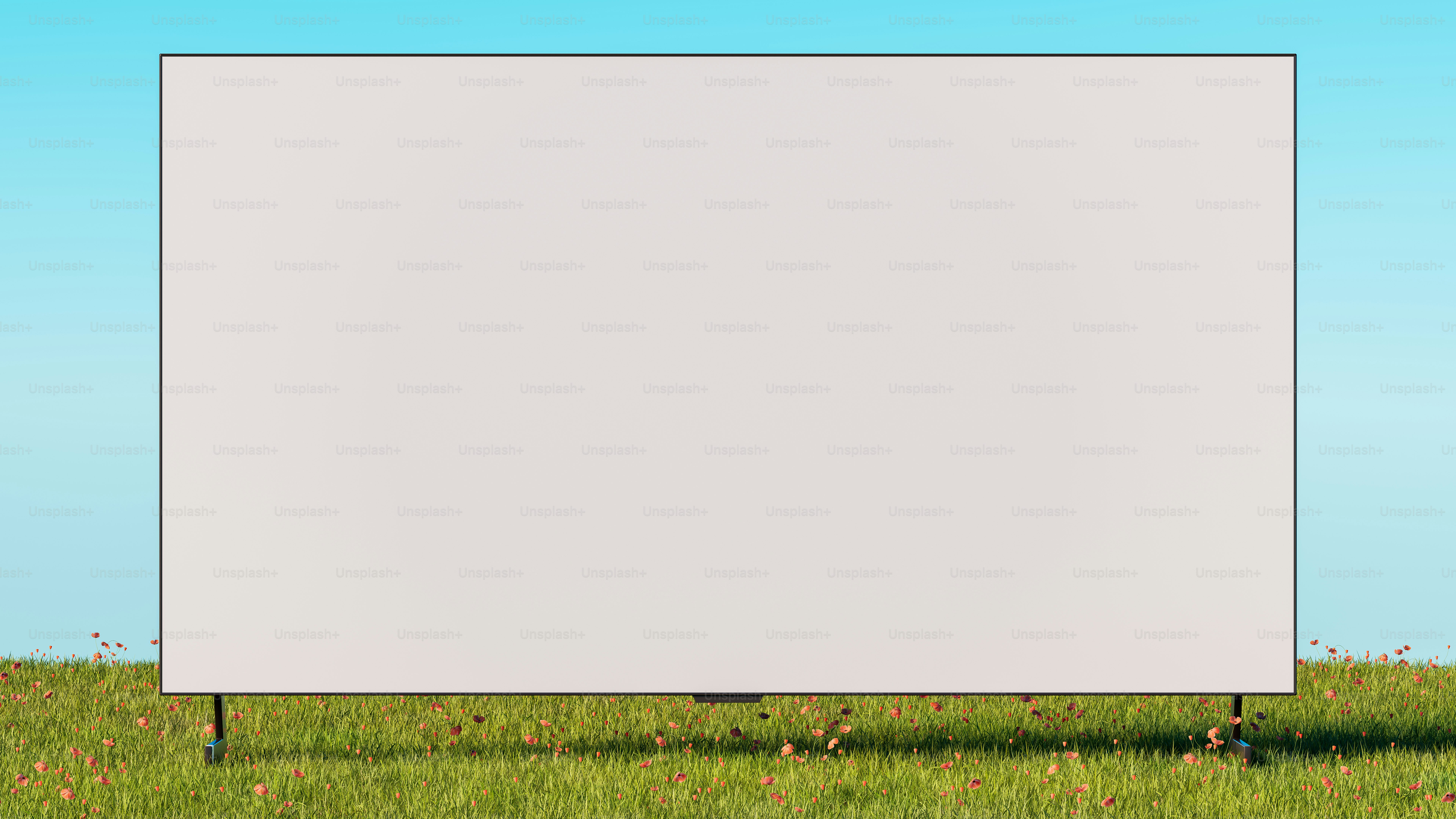 a large white sign sitting in the middle of a field