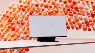 a computer monitor sitting on top of a desk