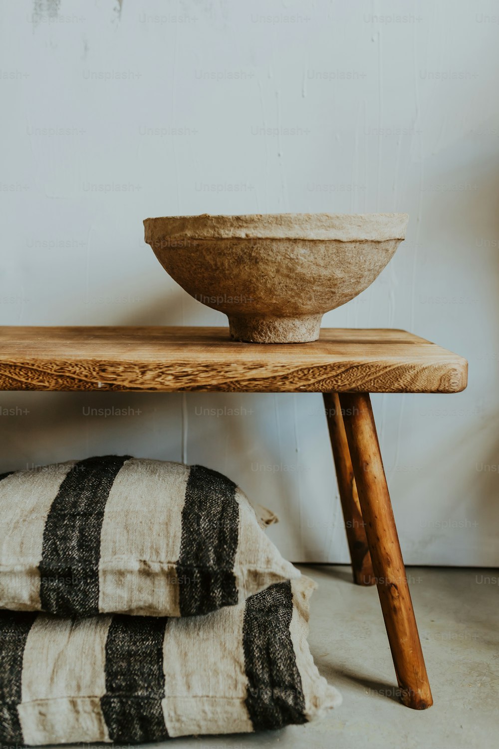 a bowl sitting on top of a wooden table