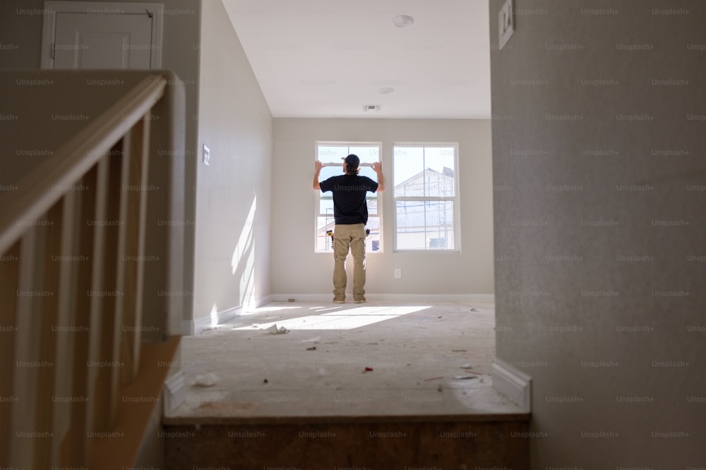 a person standing in a room with a door open