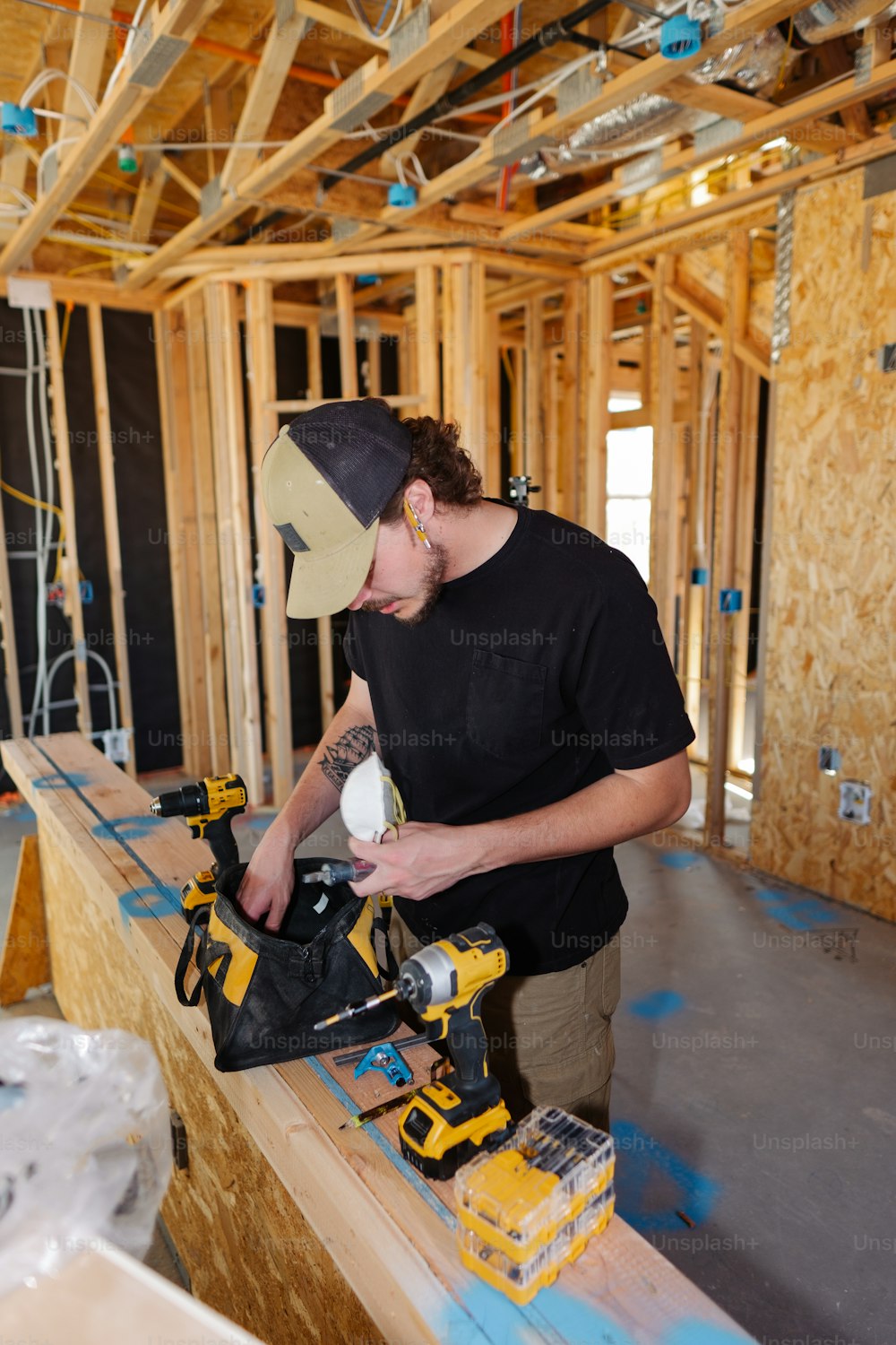 a man working on a construction project with a power drill