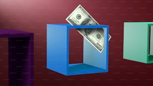 a dollar bill sticking out of a blue box