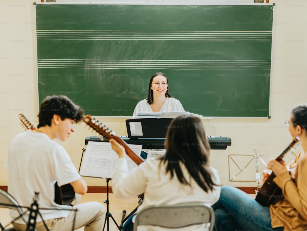 a group of people playing instruments in front of a blackboard