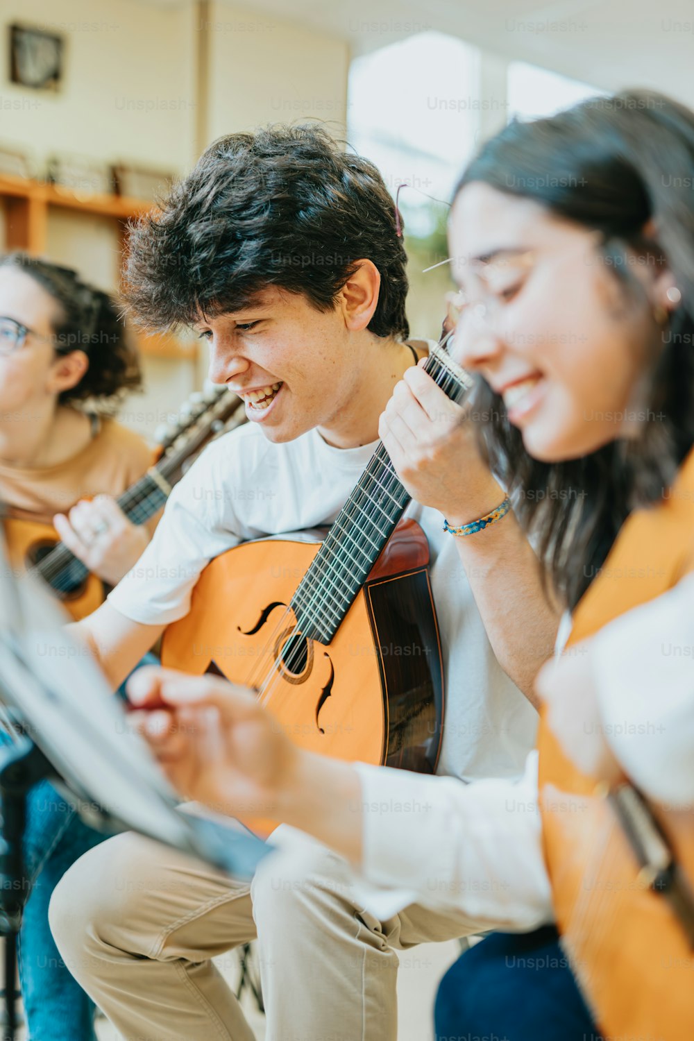 a group of young people playing musical instruments