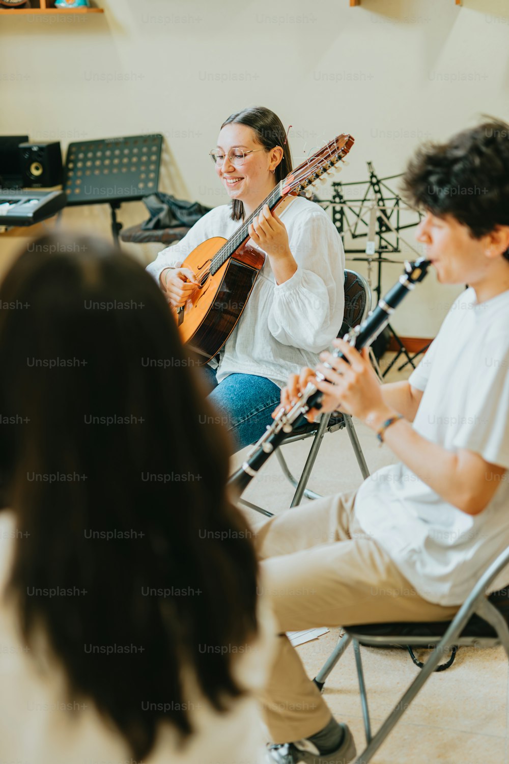 a group of people playing instruments in a room