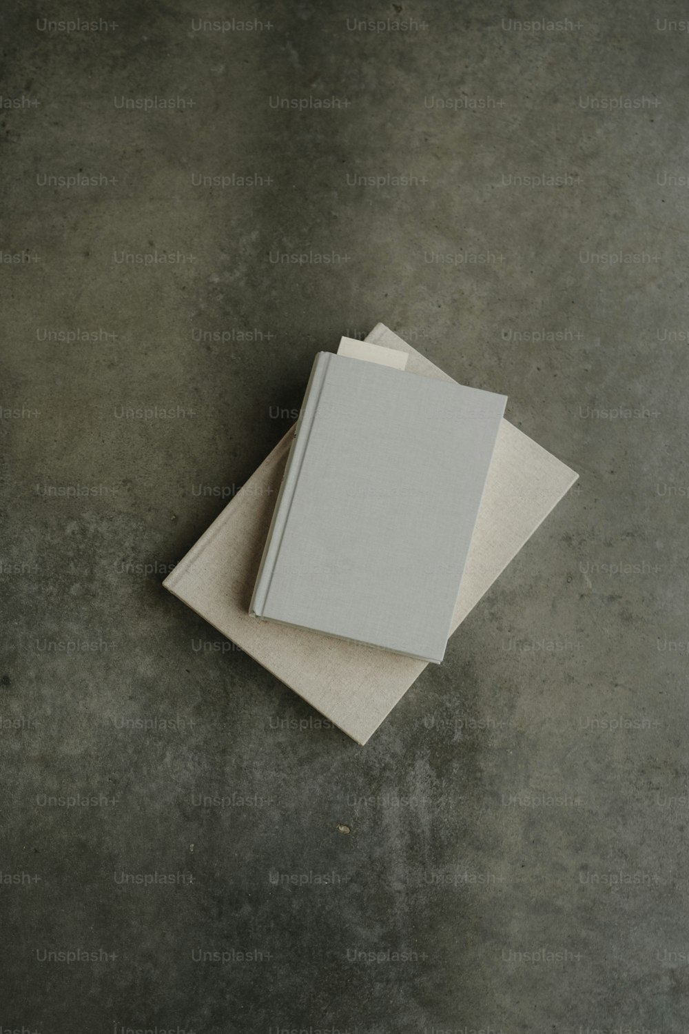 a stack of three books sitting on top of each other