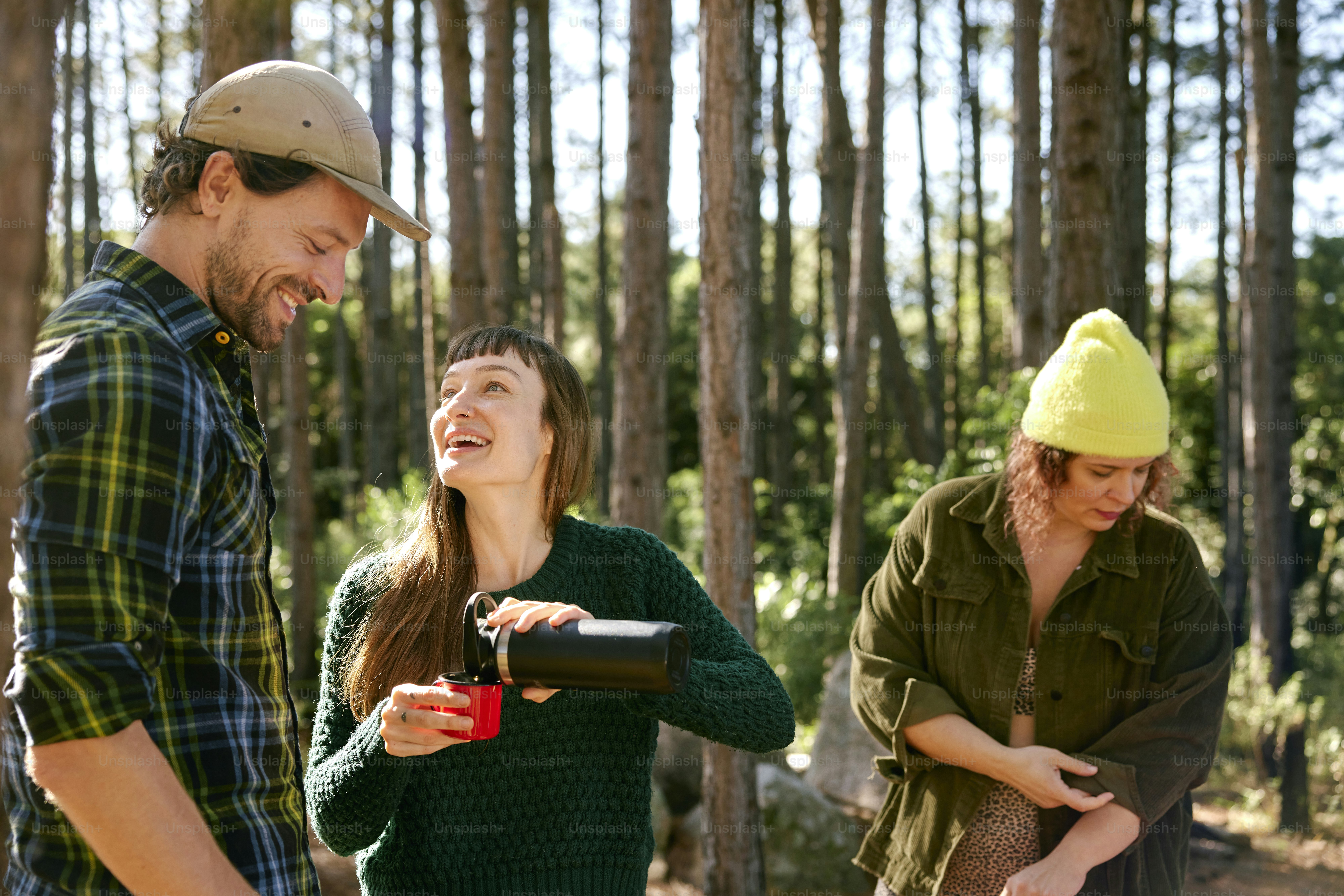 a group of people standing in a forest