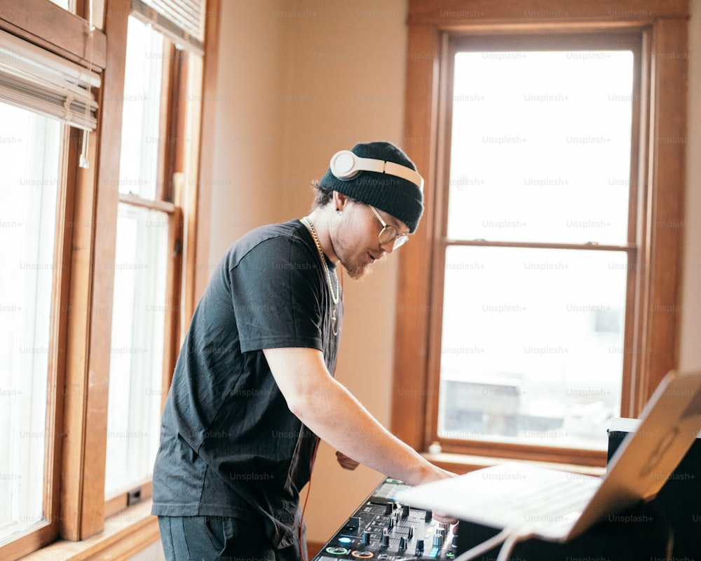 a man standing in front of a sound board