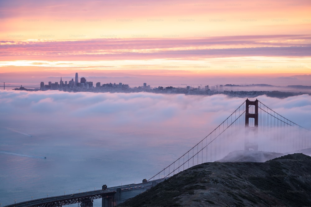 the golden gate bridge is surrounded by fog