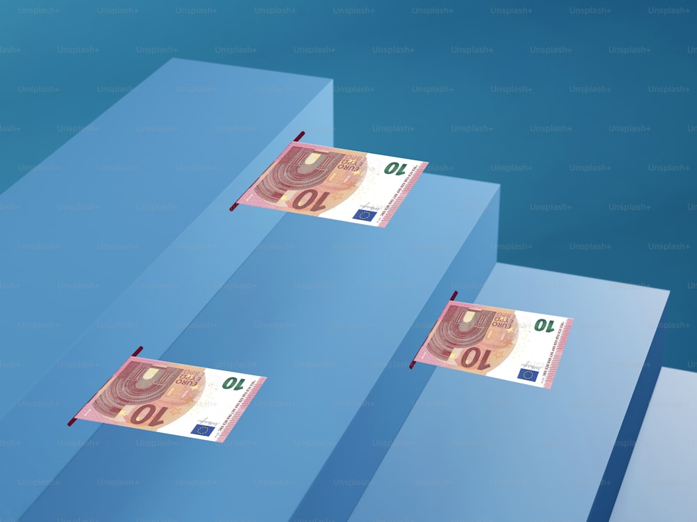 three stacks of money floating over a blue background