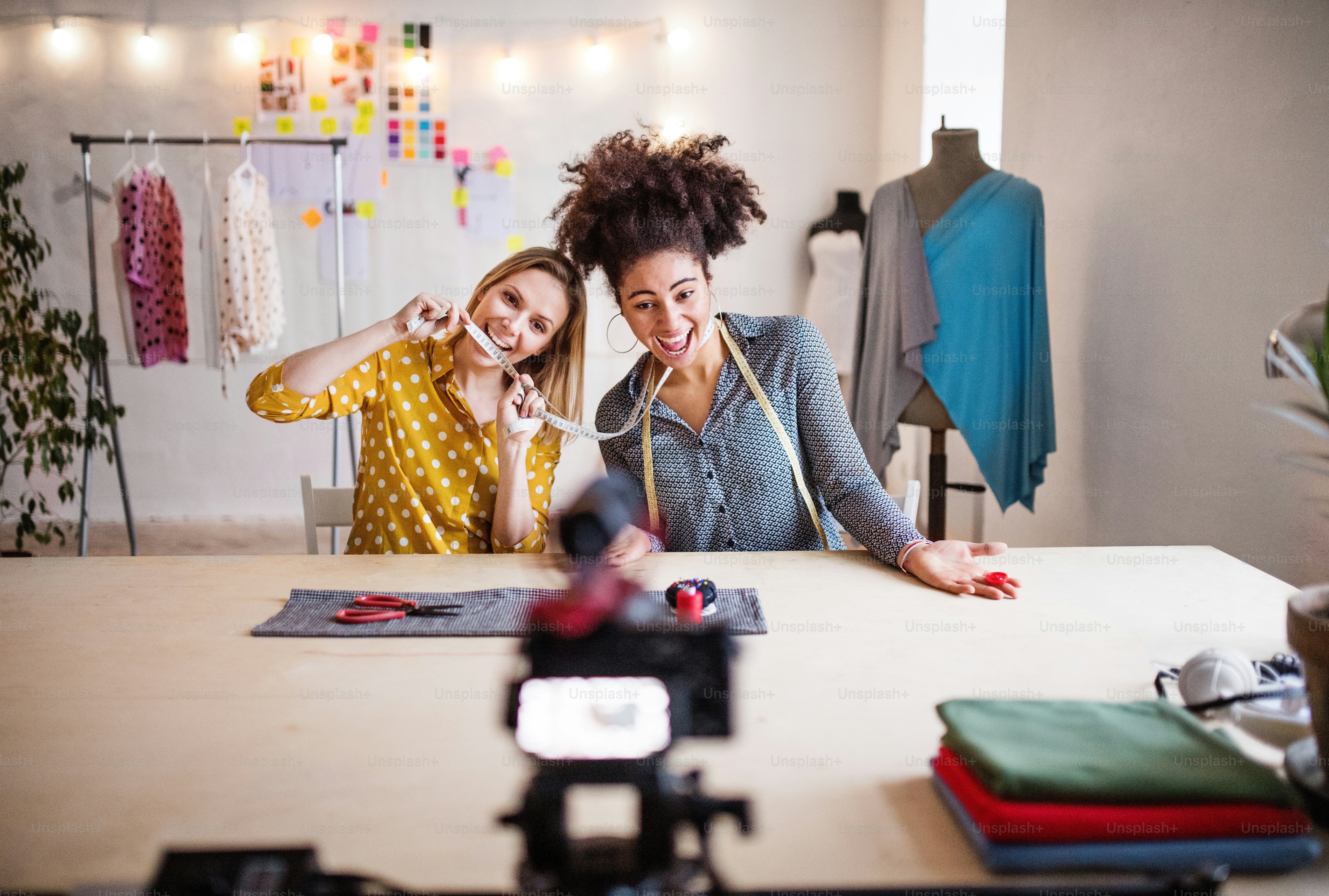 Young creative women in a studio, having fun. Startup business. photo ...