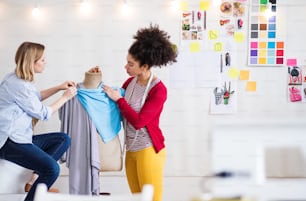 Young creative women working in a studio, startup business.