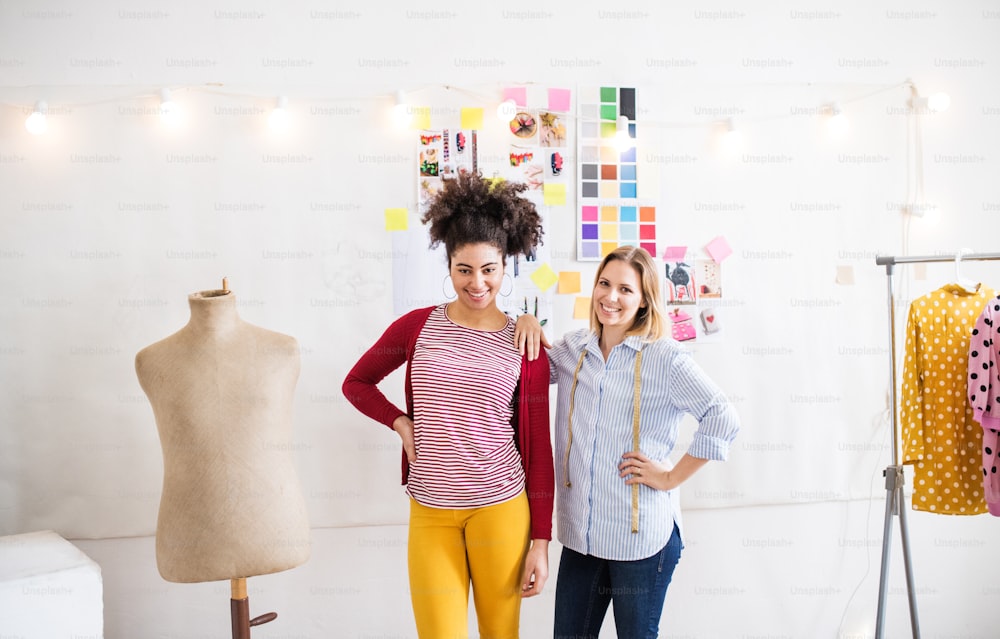 Young creative women working in a studio, startup business.