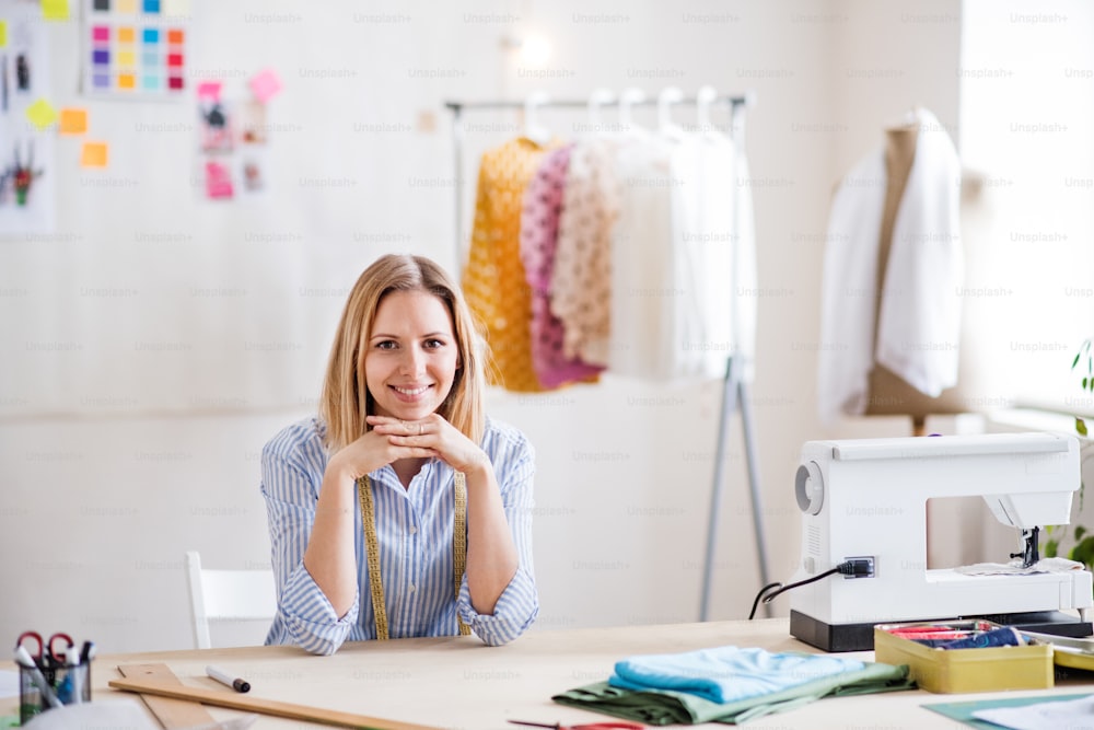 Young creative woman working in a studio, startup business.