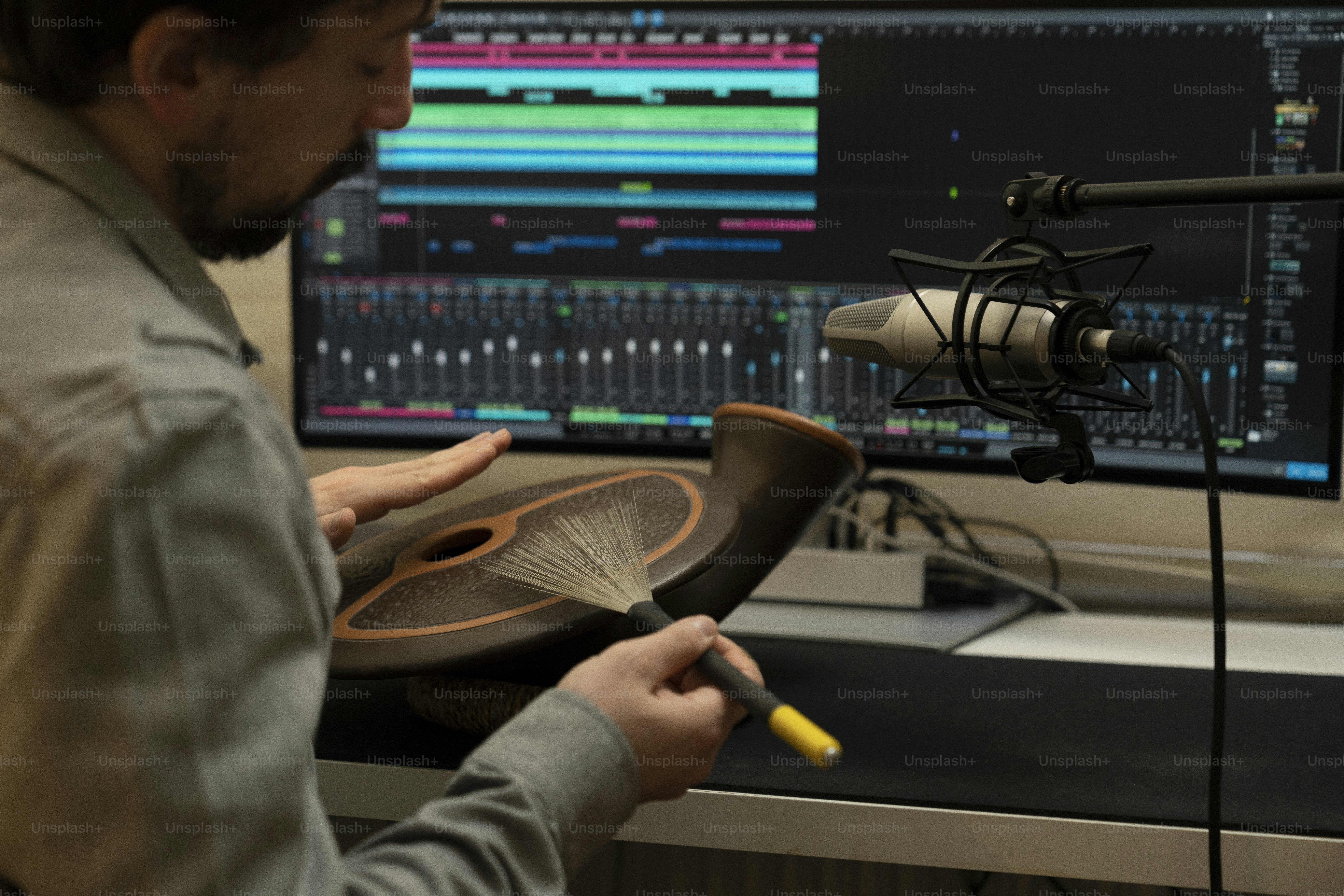 a man sitting in front of a computer screen