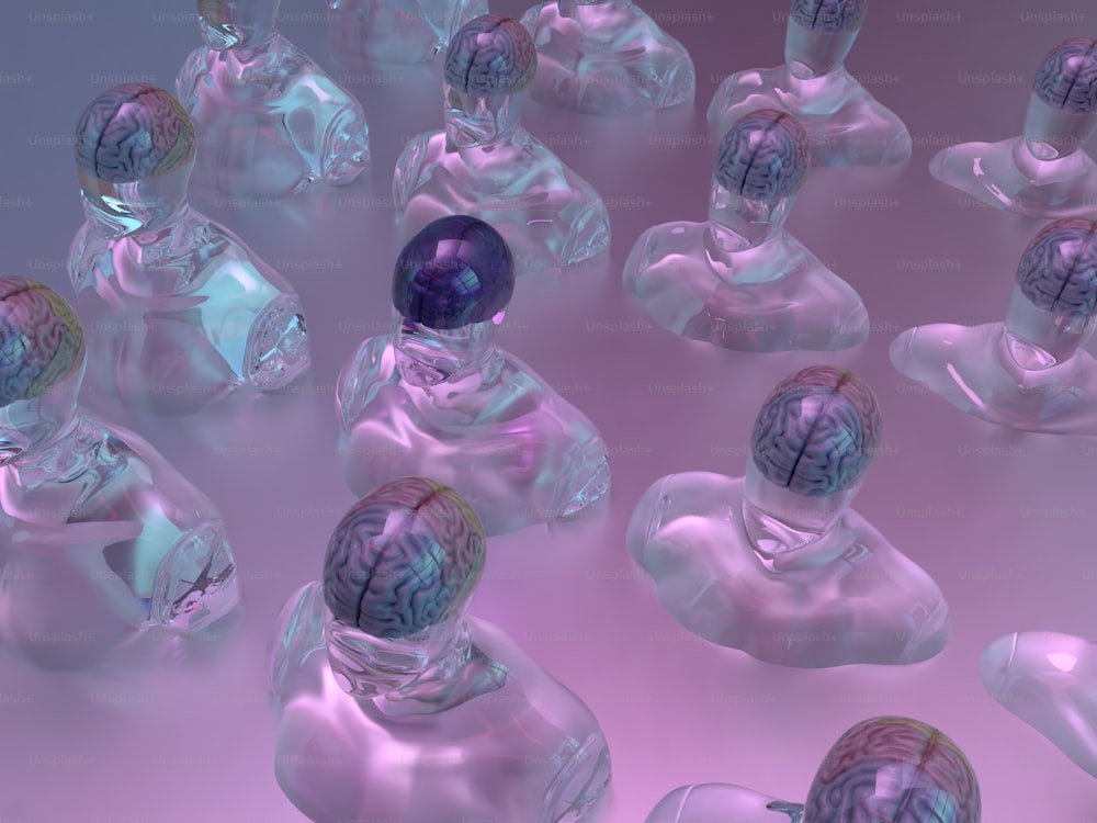a group of glass figurines with a brain in the middle