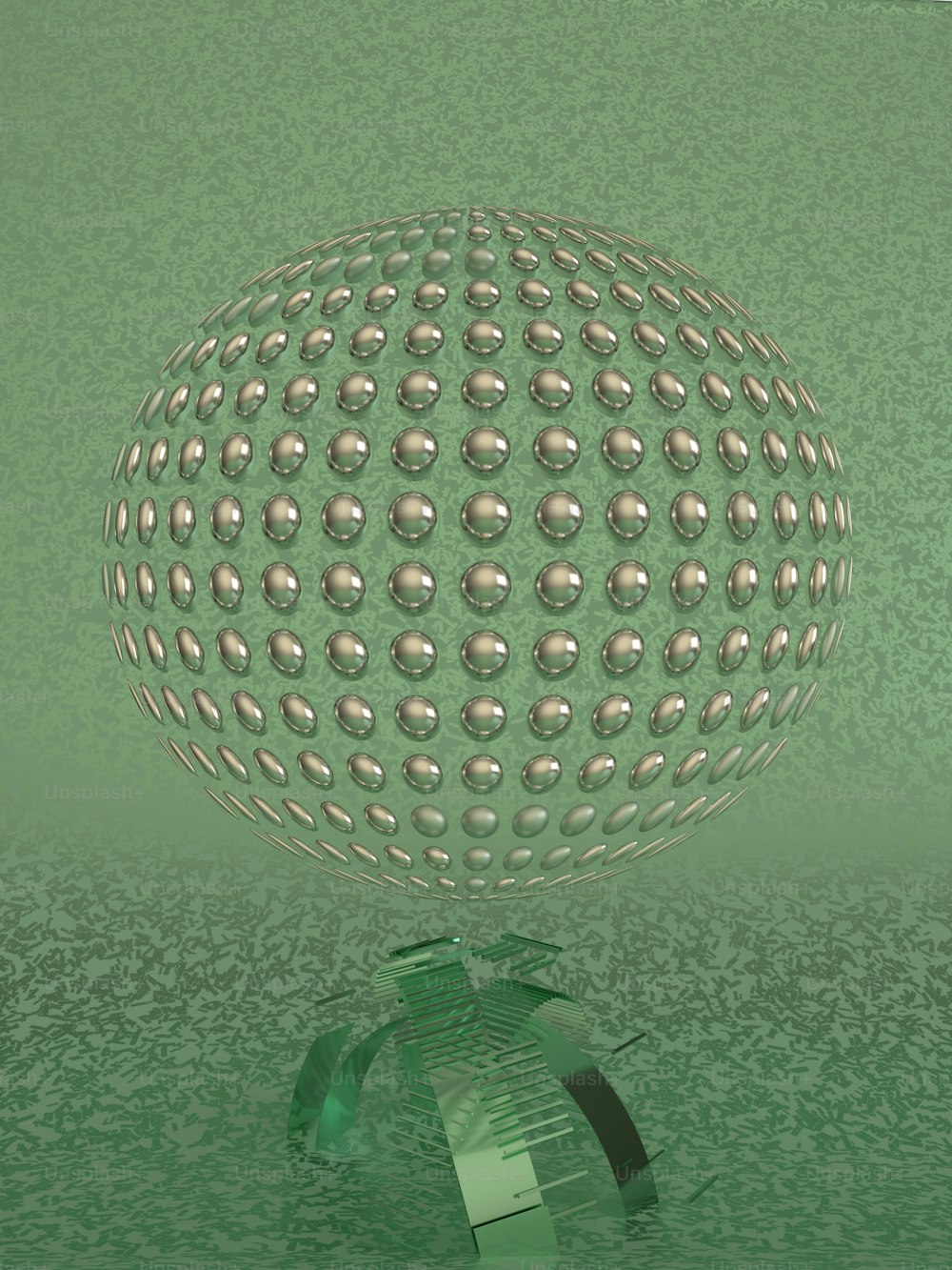 a green glass vase with a ball on top of it