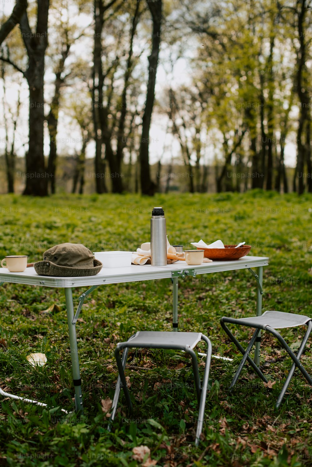a picnic table set up in the middle of a field