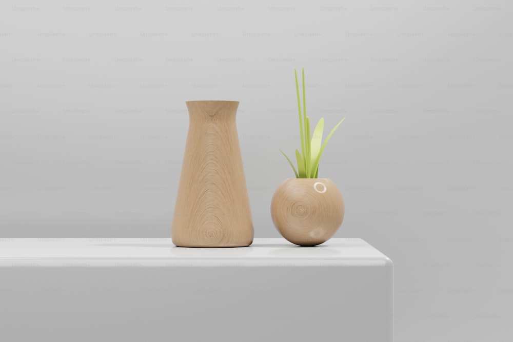 two wooden vases sitting on top of a white table