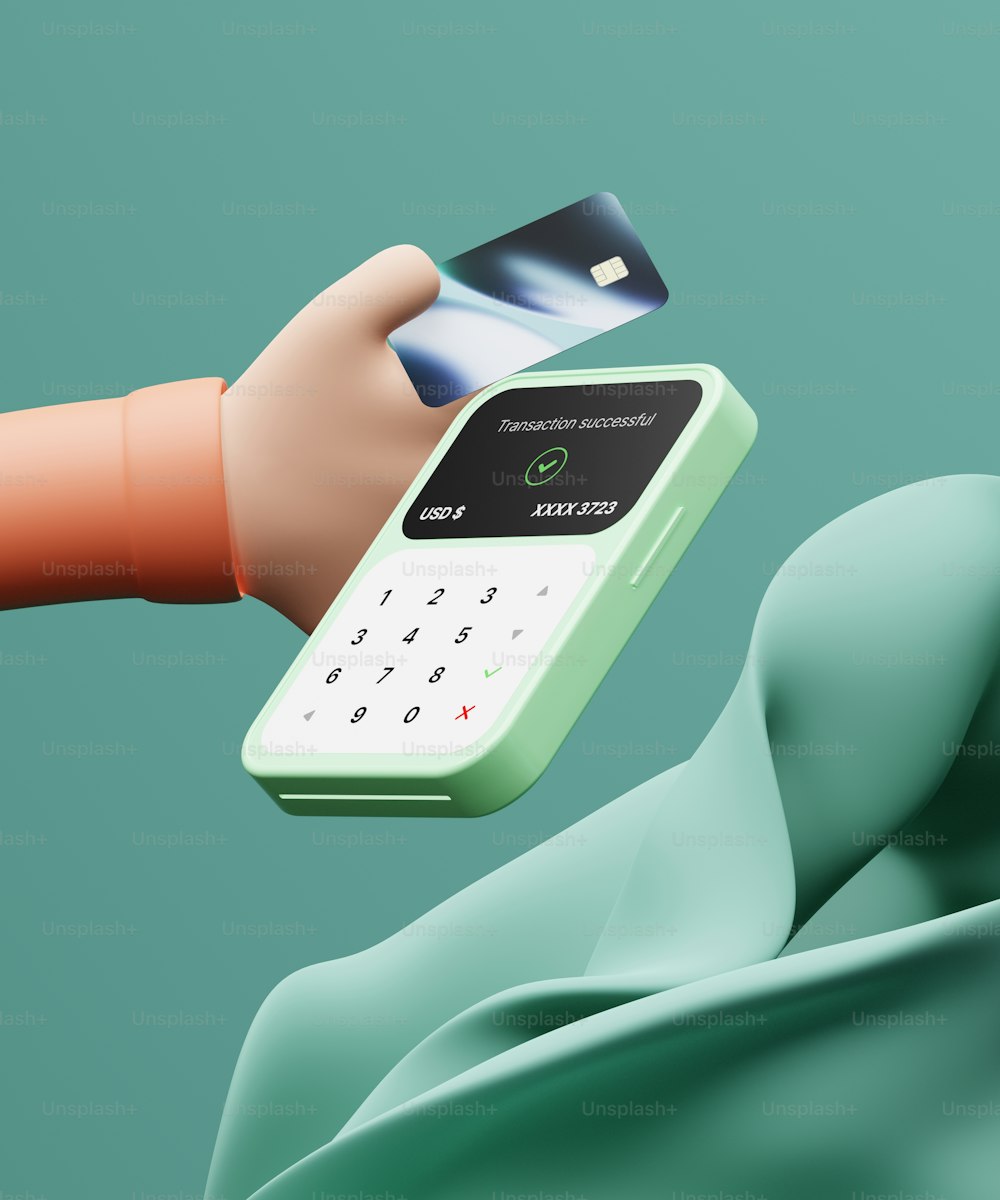 uma mão segurando um cartão de crédito e um telefone celular