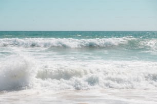 a person riding a surfboard on a wave in the ocean