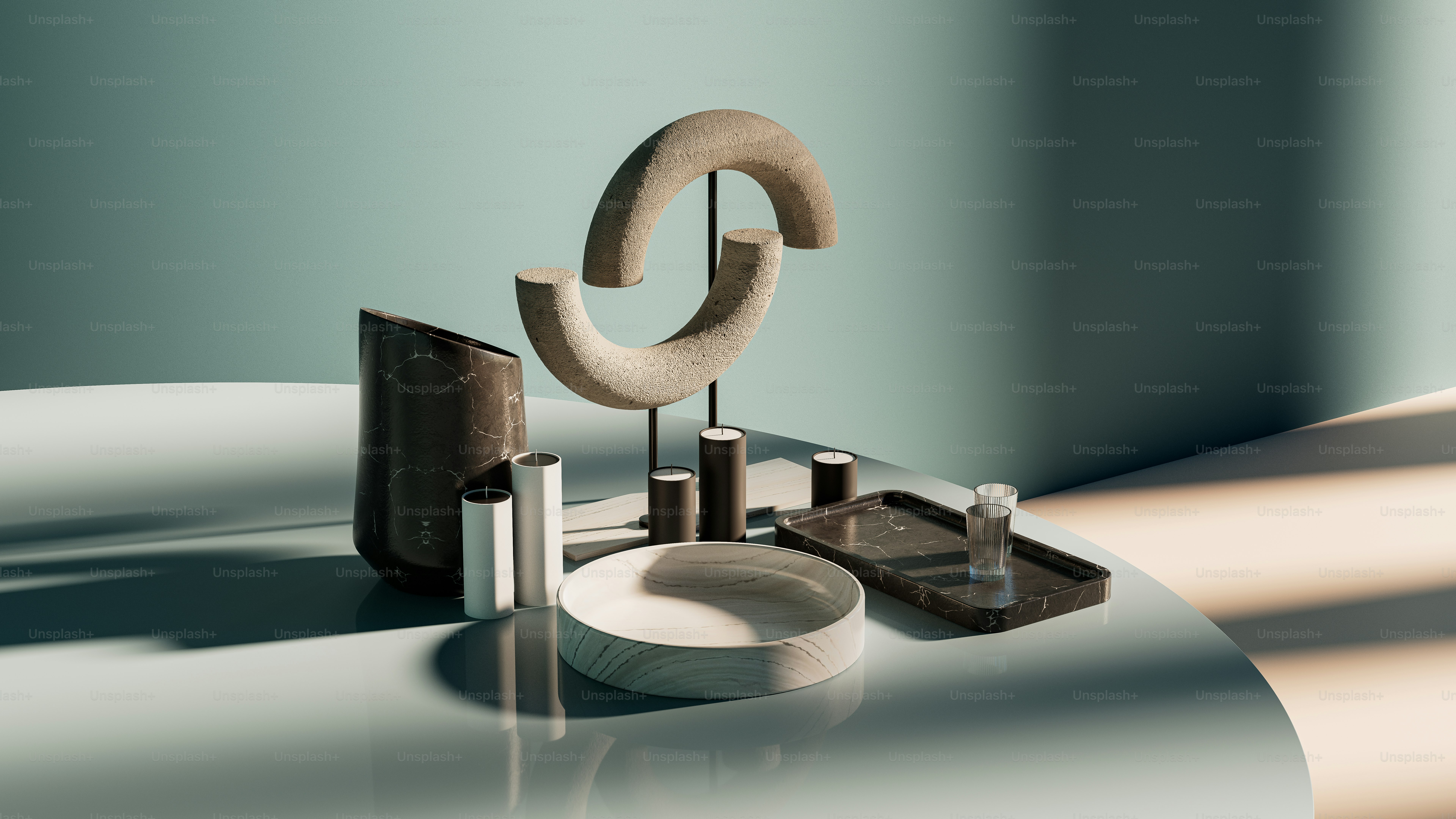 a table topped with a white plate and a sculpture