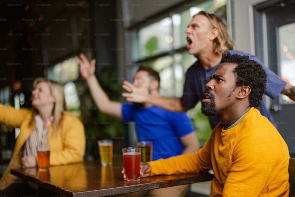 a group of people sitting at a table with drinks