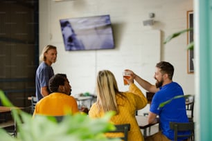 a group of people sitting around a table