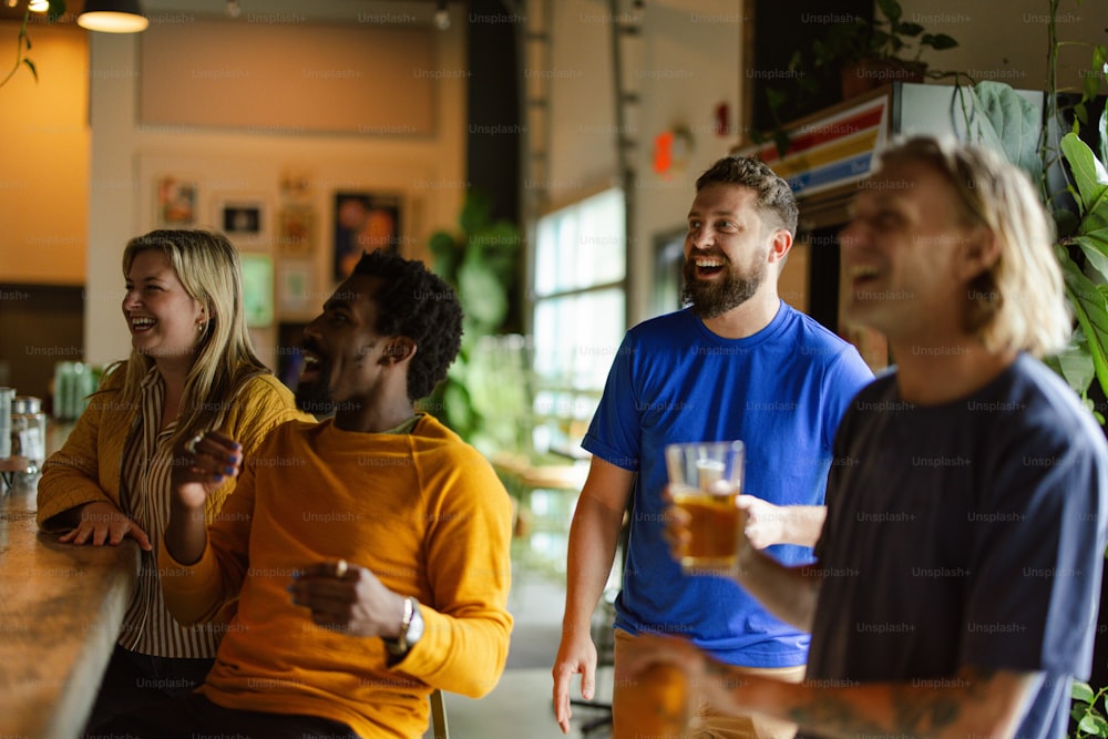 a group of people standing around a bar