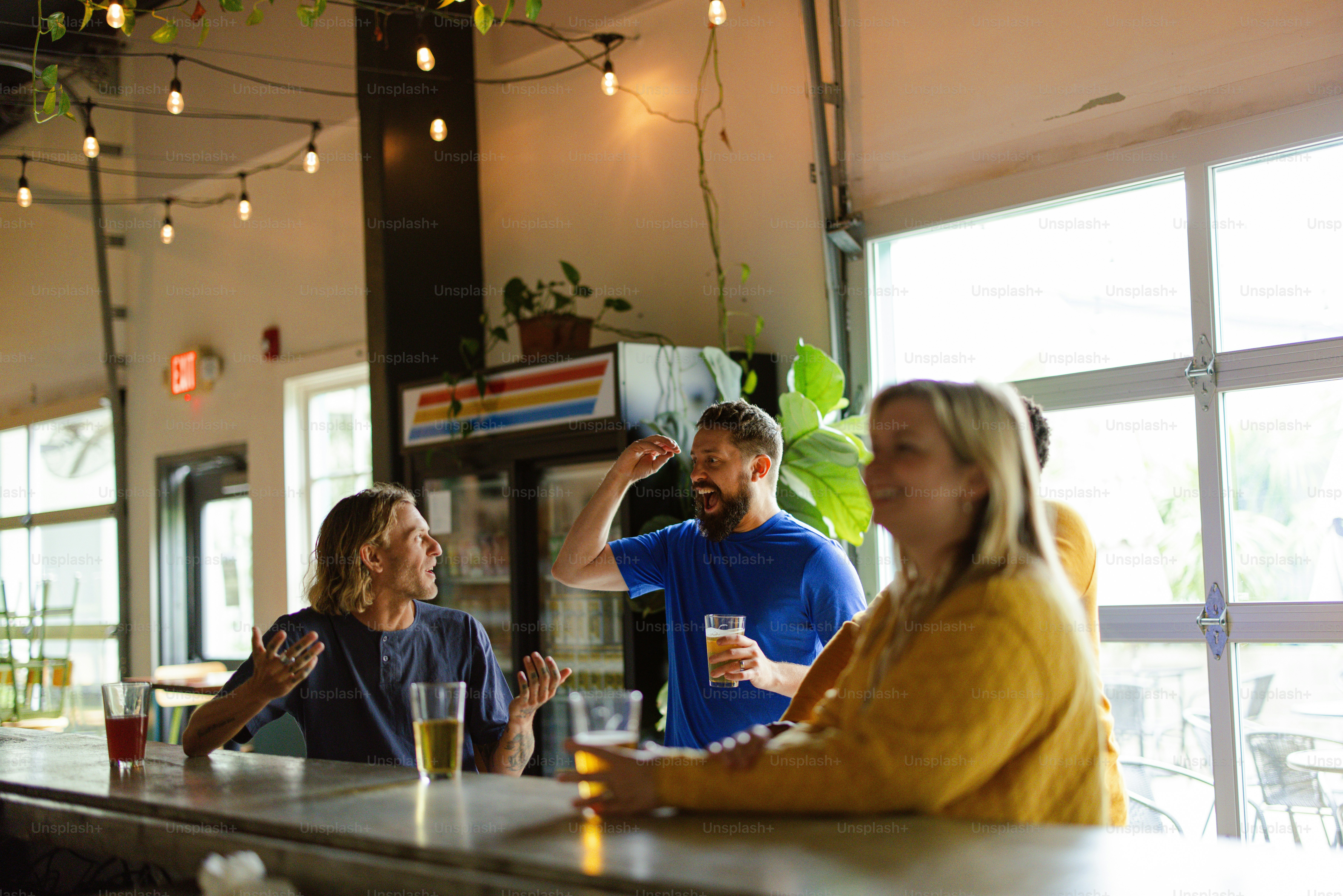 a group of people sitting at a bar