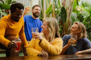 a group of people sitting around a wooden table