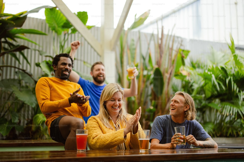 a group of people sitting at a table with drinks