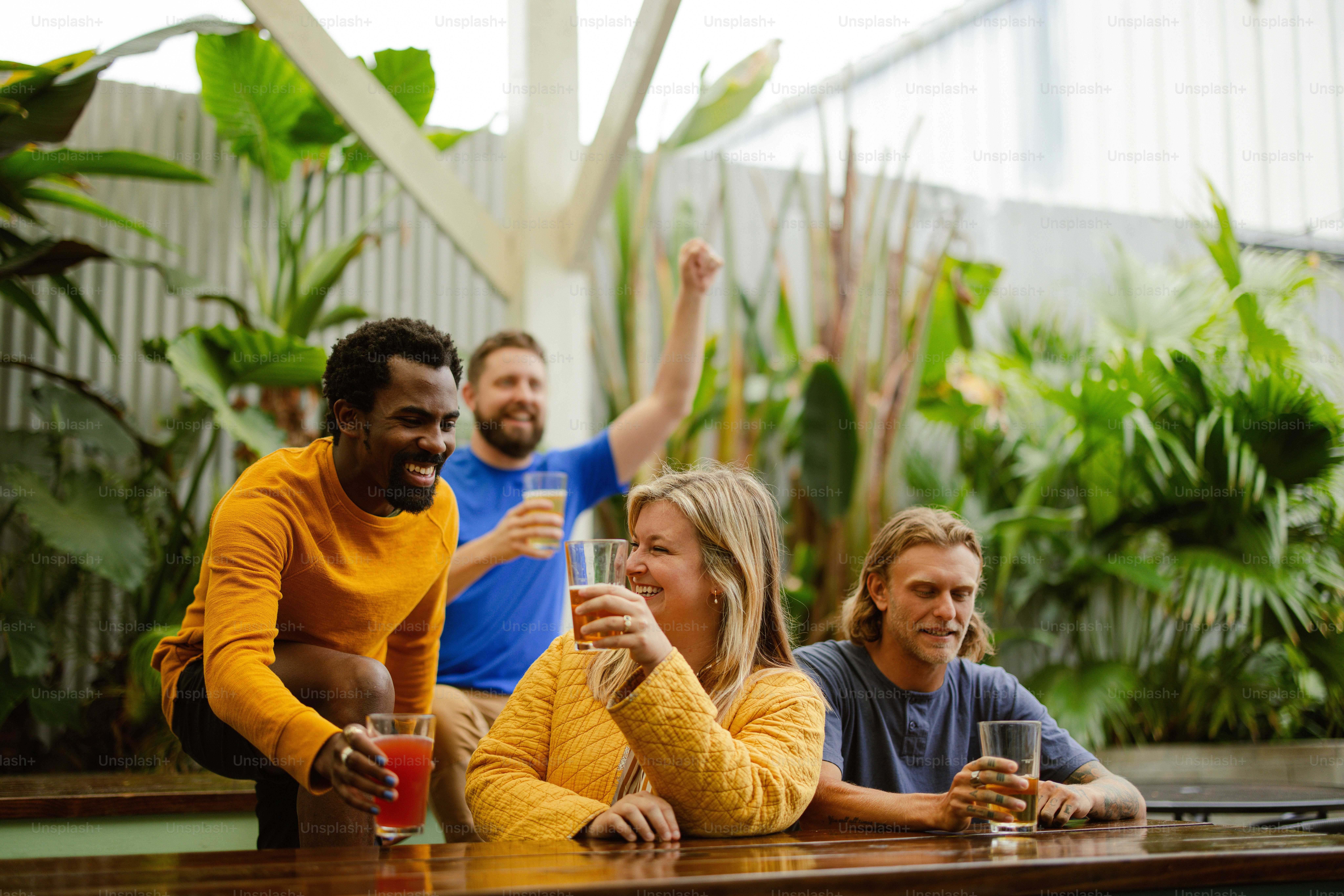 a group of people sitting at a table with drinks
