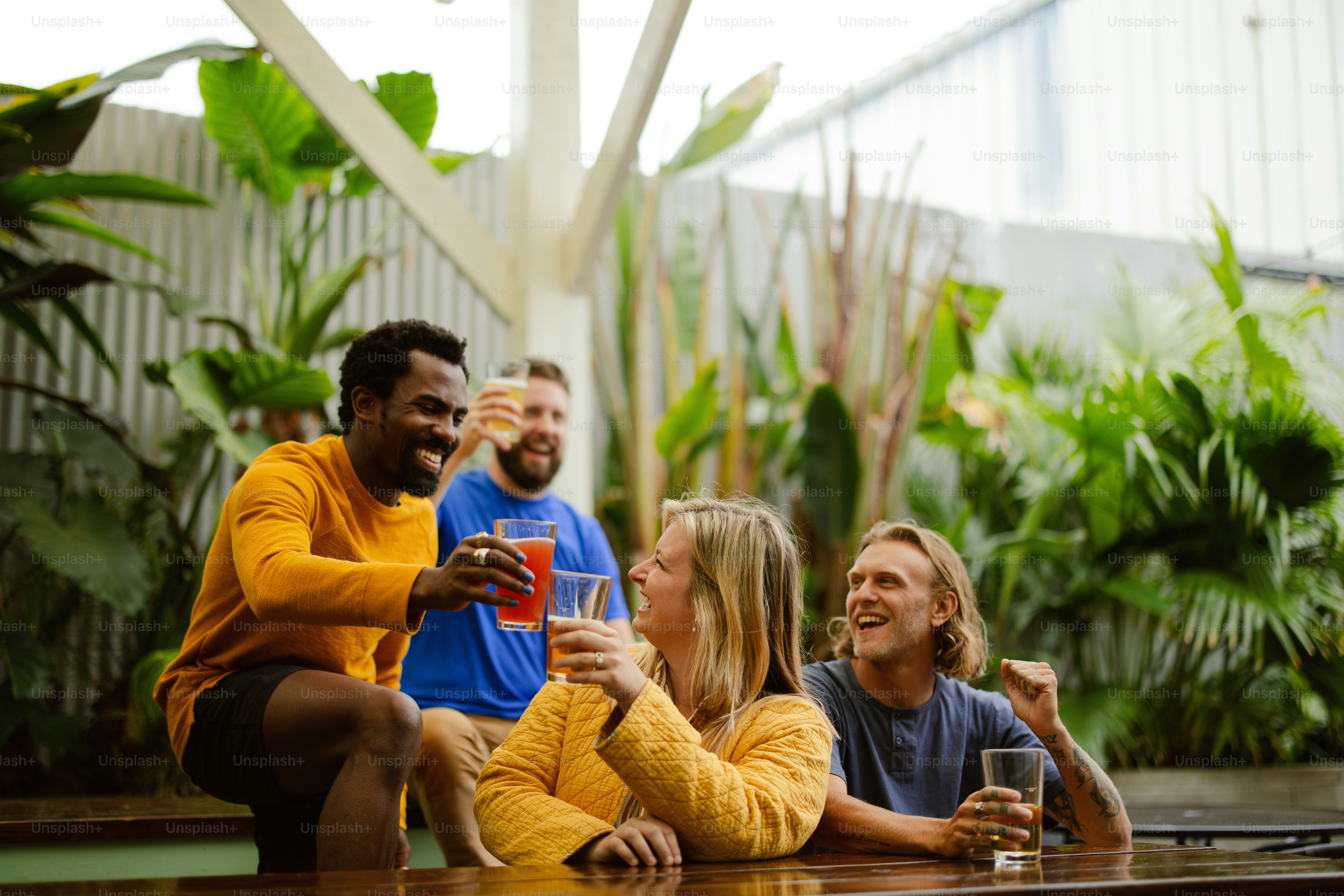 a group of people sitting around a wooden table