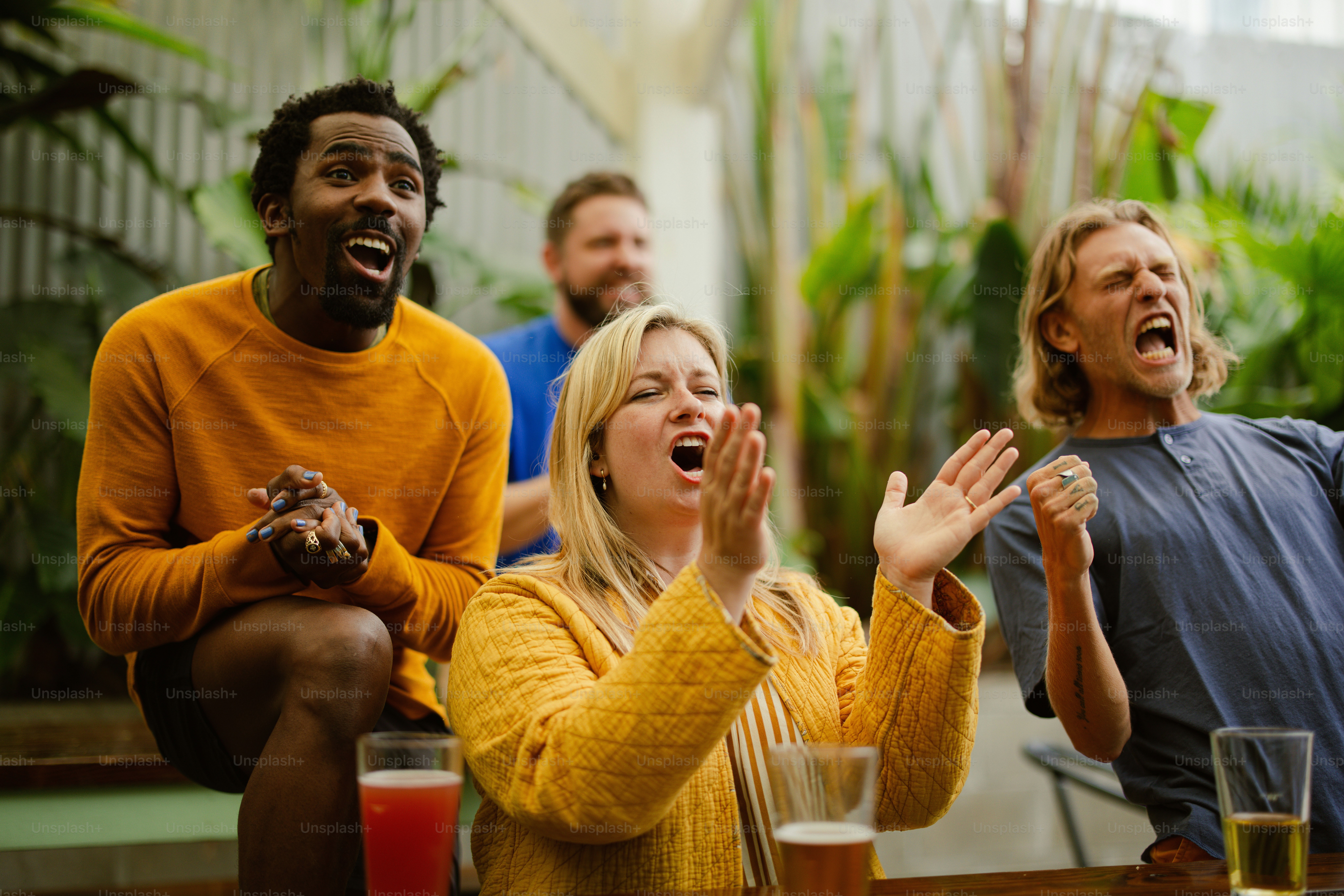 a group of people sitting around each other