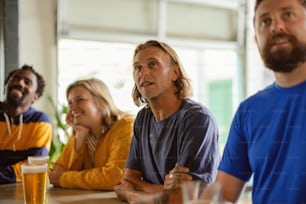 a group of people sitting around a table