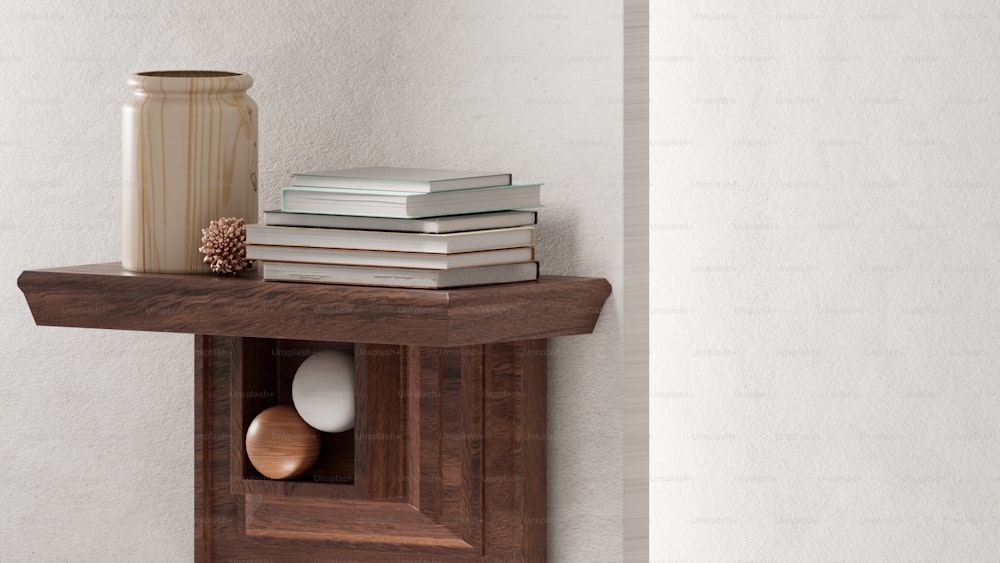 a wooden shelf with a vase and books on top of it