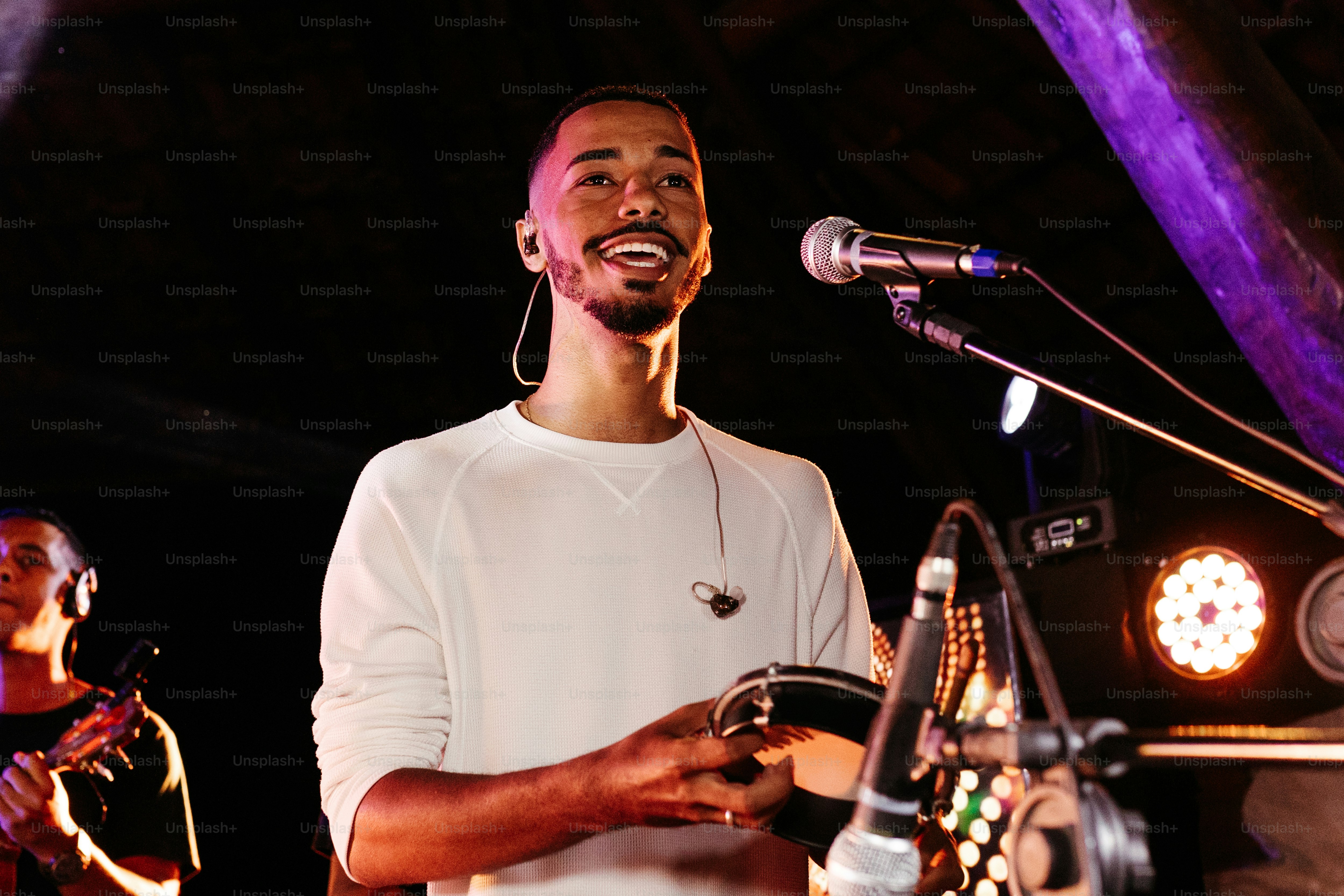 a man standing in front of a microphone