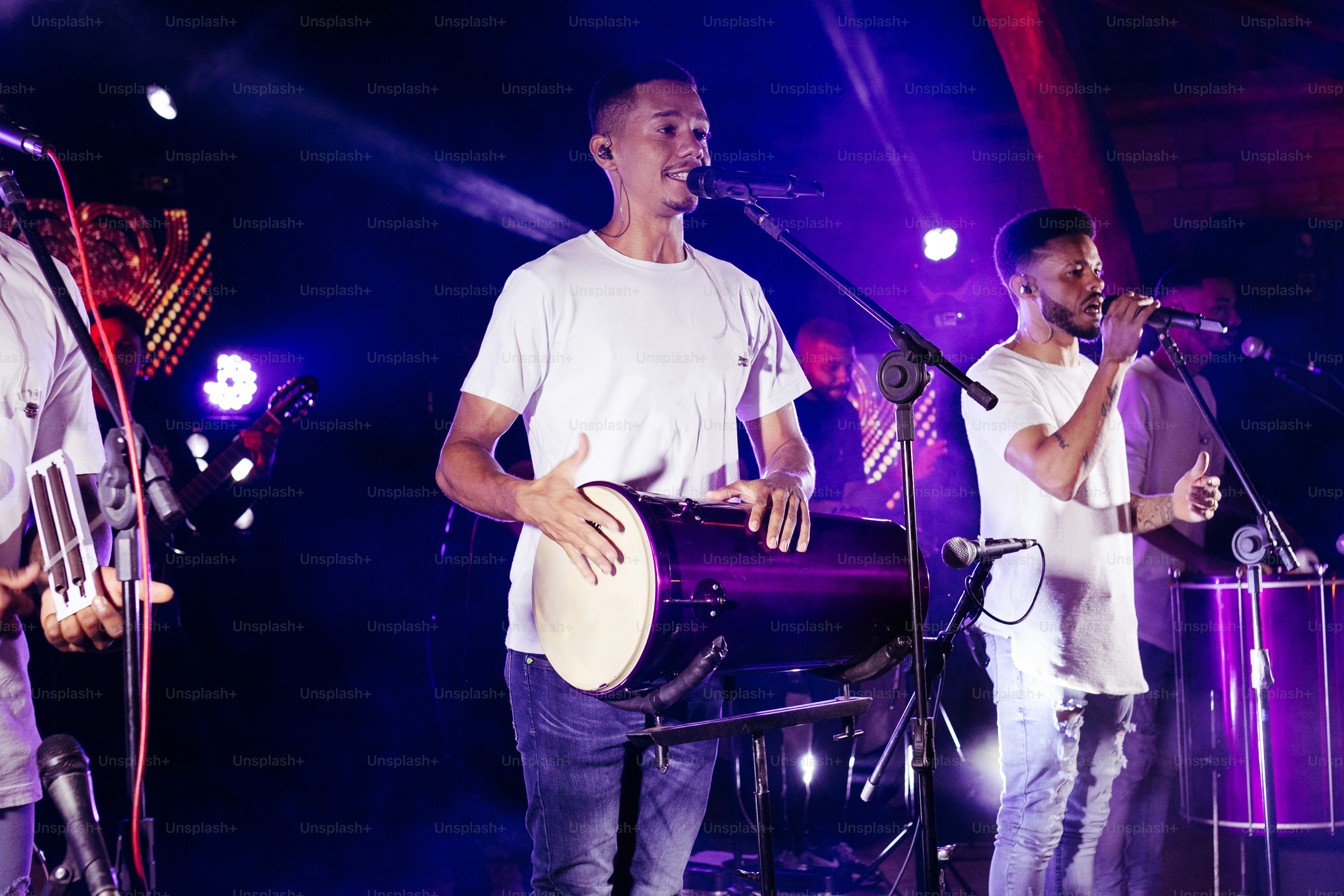 a group of men standing next to each other on a stage