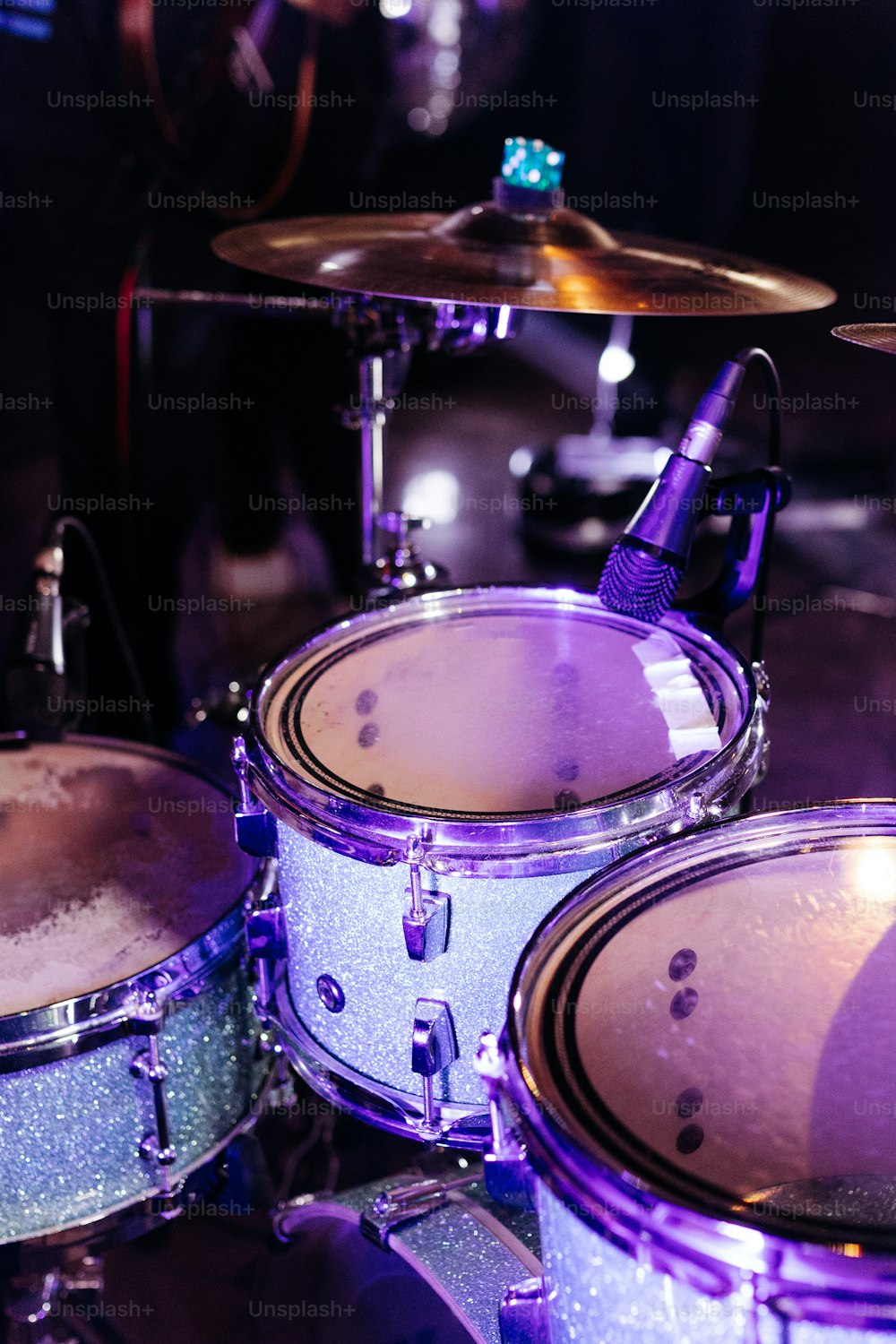 a close up of a drum set on a stage