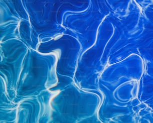 a close up of a pool with blue water
