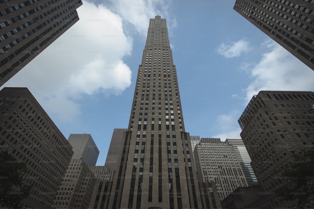 a very tall building towering over a city