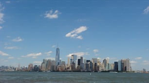 a large body of water with a city in the background