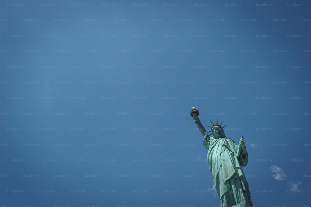 a view of the statue of liberty from below